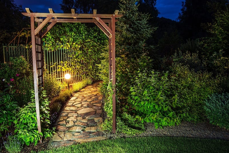 Accentuating key features such as statues, arbors, entryways, or large trees with light ensures the focus is still on them at night. 