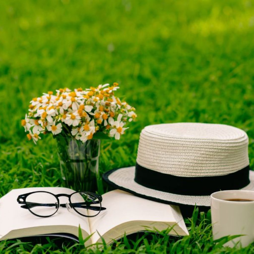 An image of a gardening book and flowers. 