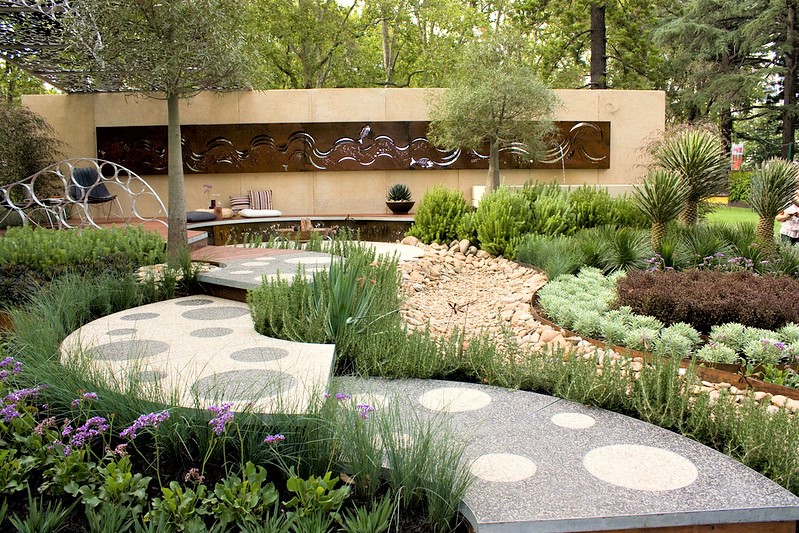 Create a subtle elevation change and a curved direction, both meant to suggest a dried-up creek bed.