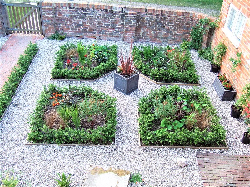 You can build on the sheer beauty of herbs in a formal parterre.