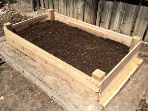 An image of a wooden raised garden bed layout.