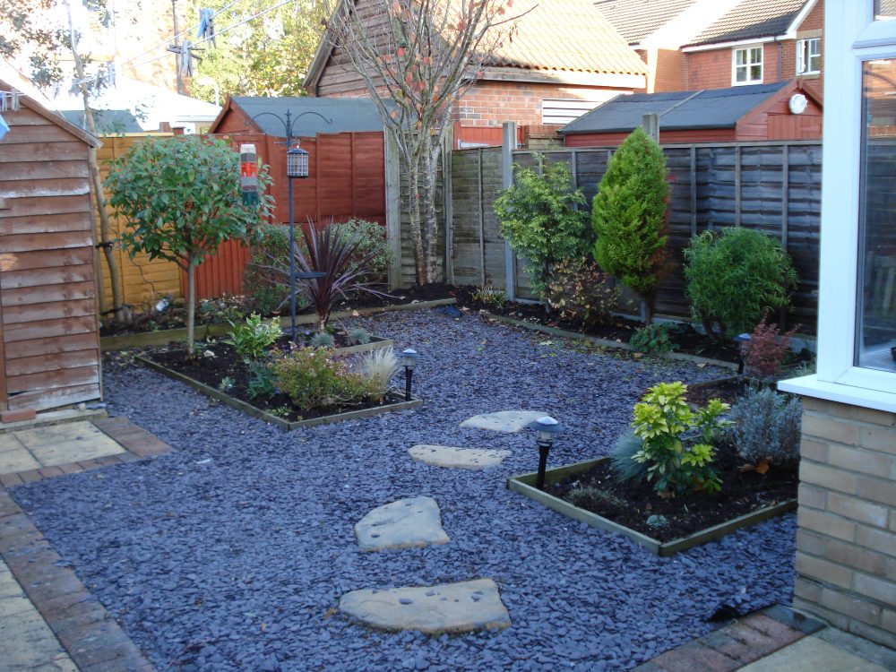 An image of a gravel garden with a stone pathway. 