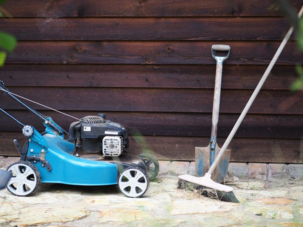 An image of a blue lawn mower.