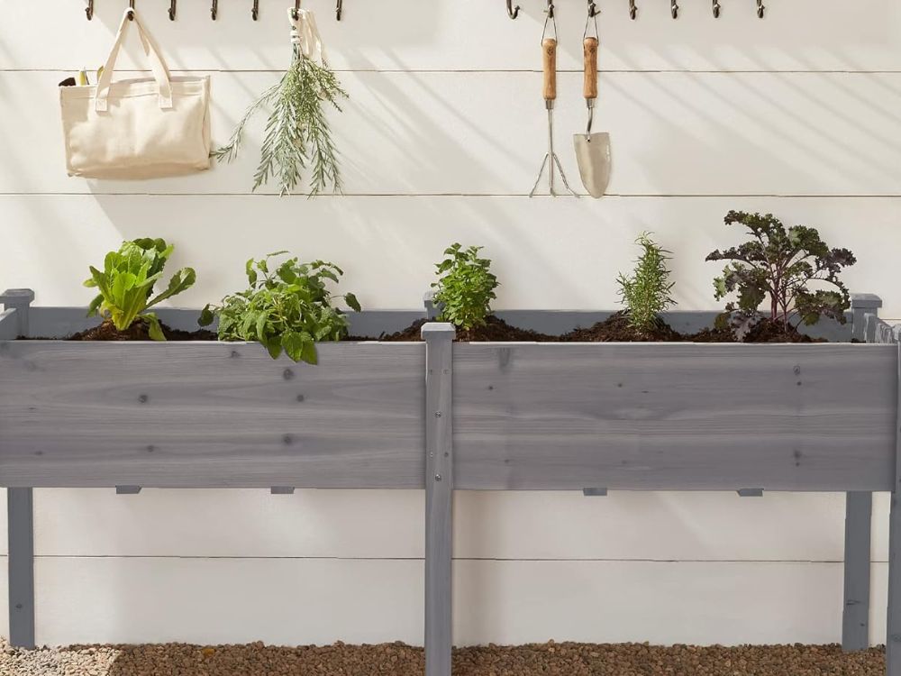 An image of a grey wooden raised garden bed. 